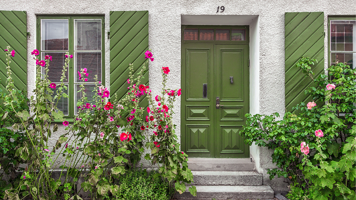 Green door on fluorescent house